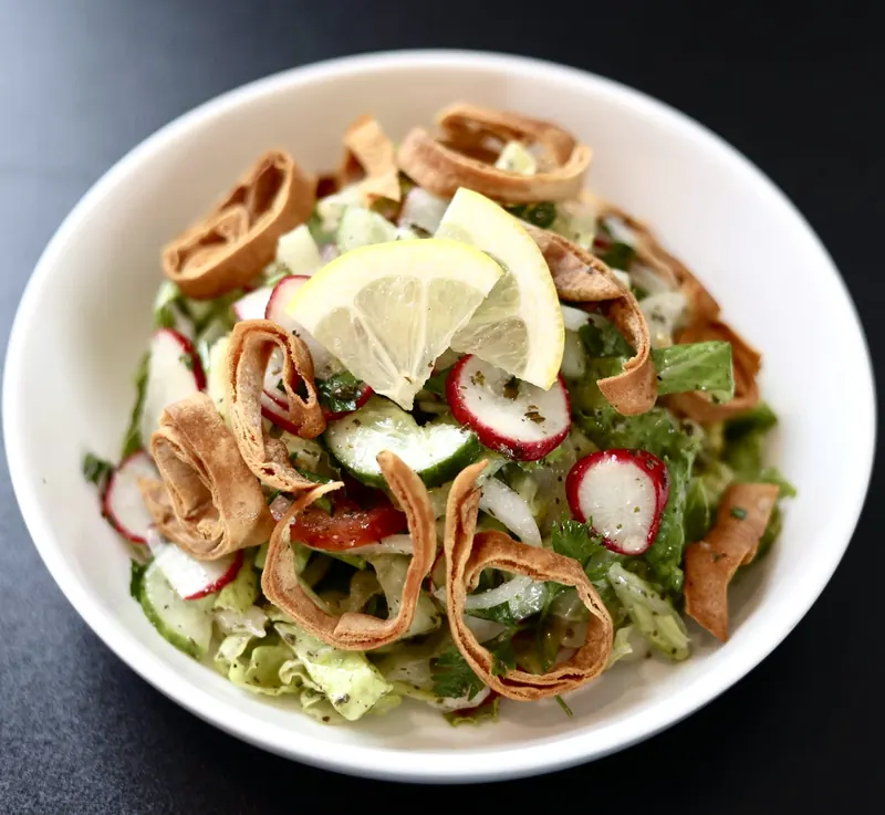 Fattoush salad with toasted pita, radish, cucumber, lemon and garden greens at Leymoon Kitchen