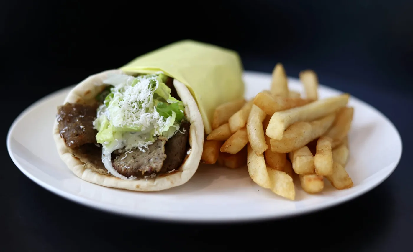 Gyro wrap with lettuce and feta in warm Greek pita, served with fries at Leymoon Kitchen